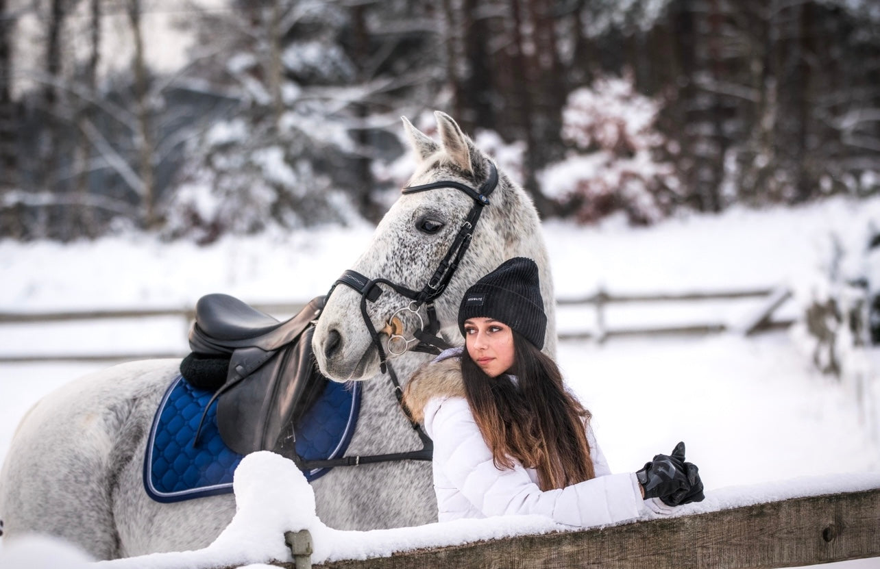 Aurorish equestrian team rider Sofija with a grey horse Centebo, Centebo wears Midnight blue saddle pad and pa of Sweden bridle model High Jump 